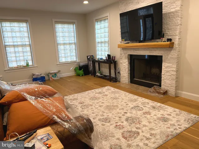 a bed room with a bed and a television