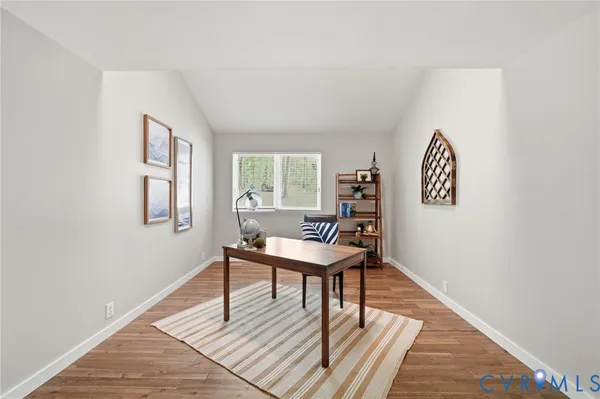 a workspace with furniture and window