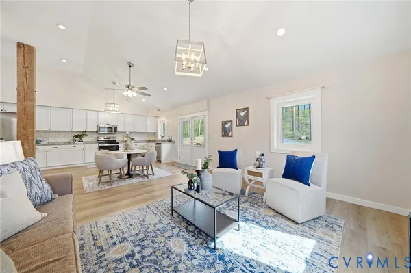a living room with furniture and a rug