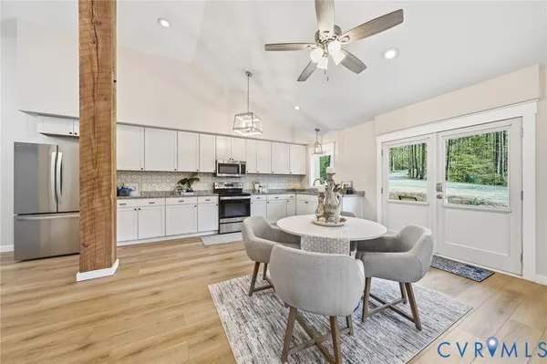 a view of kitchen with refrigerator stove and kitchen island