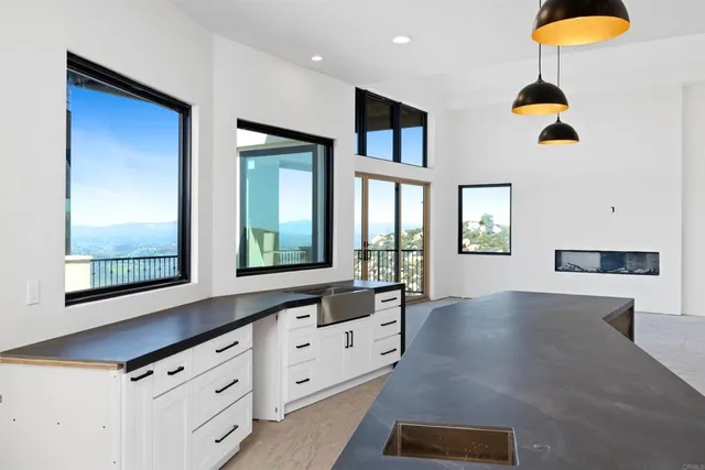 a kitchen with sink and window