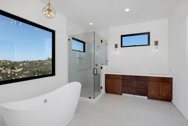 a bathroom with a tub and a shower