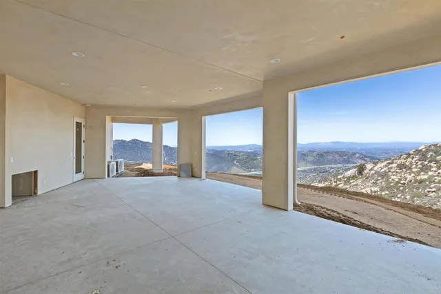 a view of an empty room and window