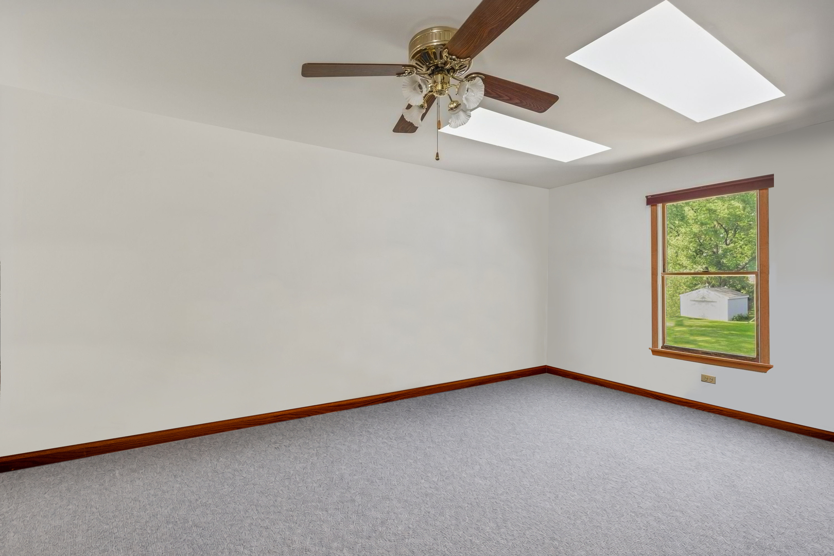 7062 Osage Road Long Grove, IL 60060 - Photo 13 of 25 an empty room with a window and a fan