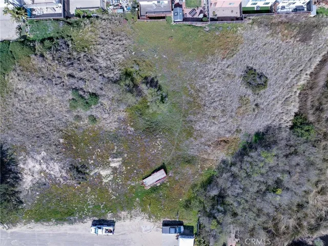 a view of a backyard with sitting area
