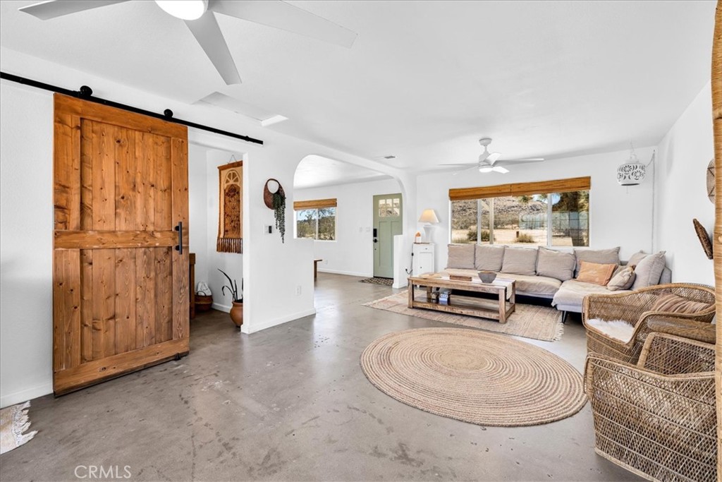 59700 Napa Road Landers, CA 92285 - Photo 13 of 68 a living room with furniture and a large window