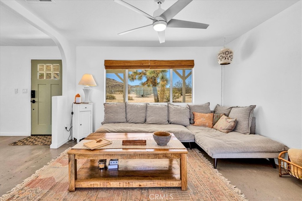59700 Napa Road Landers, CA 92285 - Photo 14 of 68 a living room with furniture and a chandelier