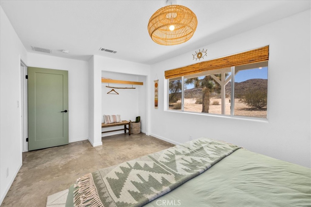59700 Napa Road Landers, CA 92285 - Photo 29 of 68 a view of a room with wooden floor and window