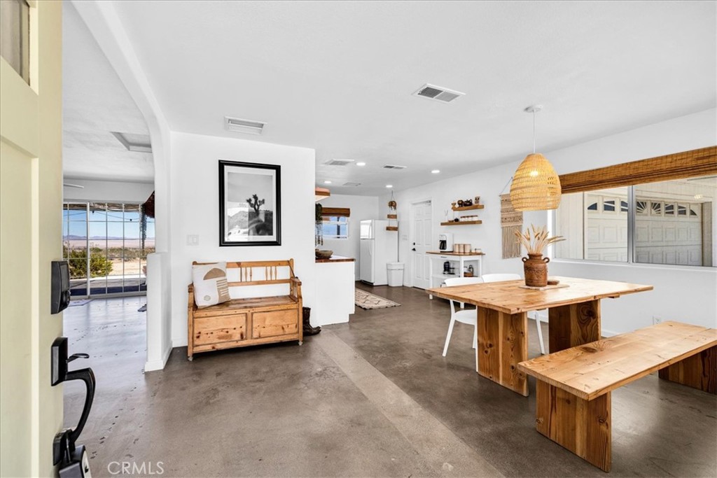 59700 Napa Road Landers, CA 92285 - Photo 9 of 68 a living room with furniture a table and kitchen view