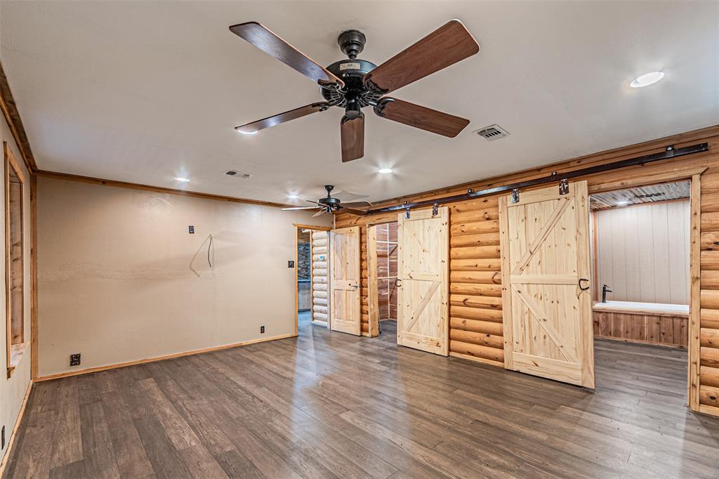 1398 Zagota Crossing Road Terrell, TX 75161 - Photo 14 of 40 wooden floor in an empty room with a window