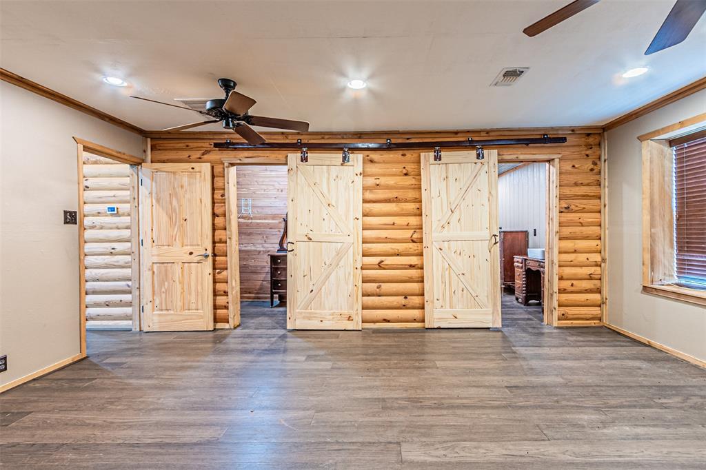 1398 Zagota Crossing Road Terrell, TX 75161 - Photo 16 of 40 wooden floor in an empty room with a window