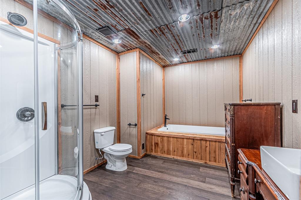 1398 Zagota Crossing Road Terrell, TX 75161 - Photo 17 of 40 a bathroom with a toilet and a shower