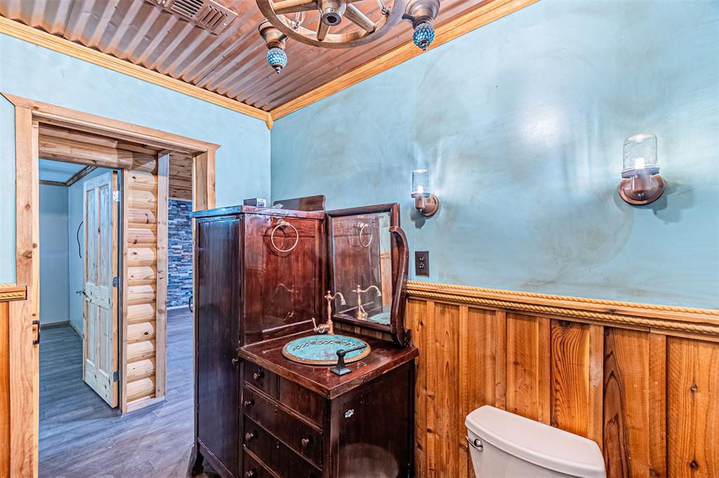 1398 Zagota Crossing Road Terrell, TX 75161 - Photo 21 of 40 a view of a hallway with furniture and wooden floor
