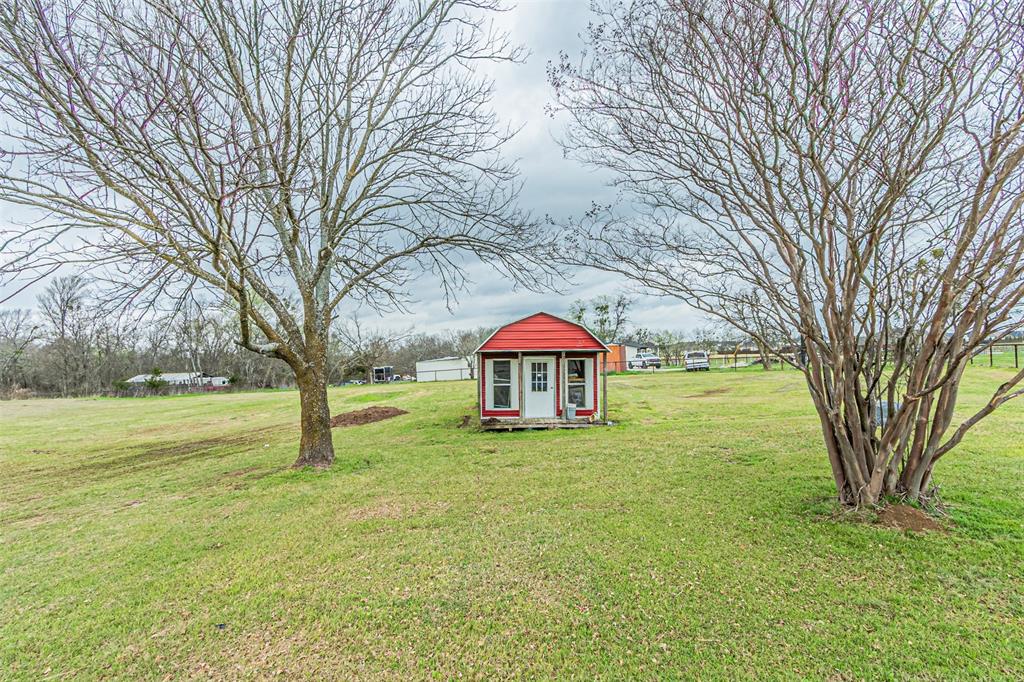 1398 Zagota Crossing Road Terrell, TX 75161 - Photo 28 of 40 a view of a house with a yard