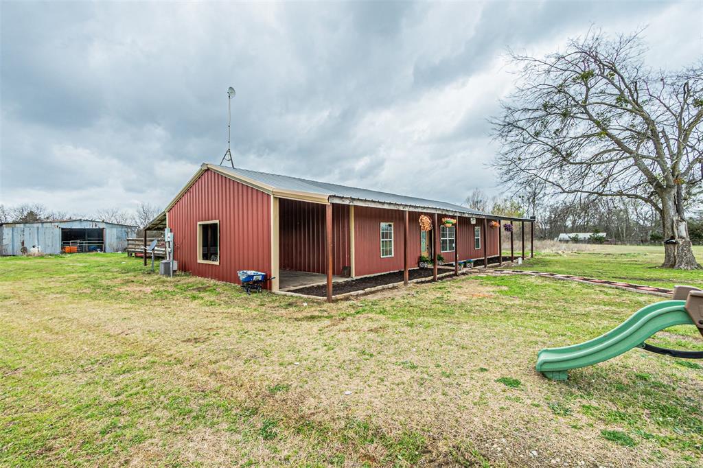 1398 Zagota Crossing Road Terrell, TX 75161 - Photo 3 of 40 a view of a house with backyard