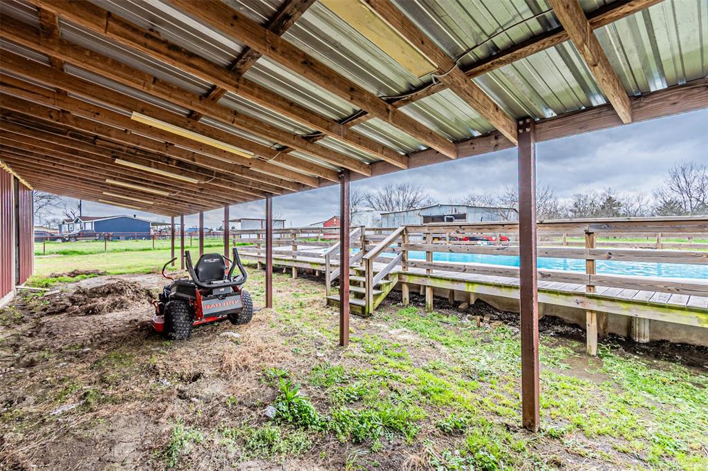 1398 Zagota Crossing Road Terrell, TX 75161 - Photo 32 of 40 a backyard of a house with a garden and outdoor seating