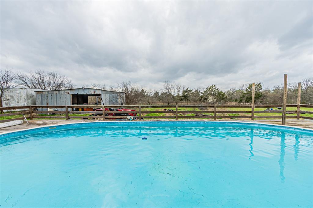 1398 Zagota Crossing Road Terrell, TX 75161 - Photo 33 of 40 a view of swimming pool with outdoor seating and yard in back