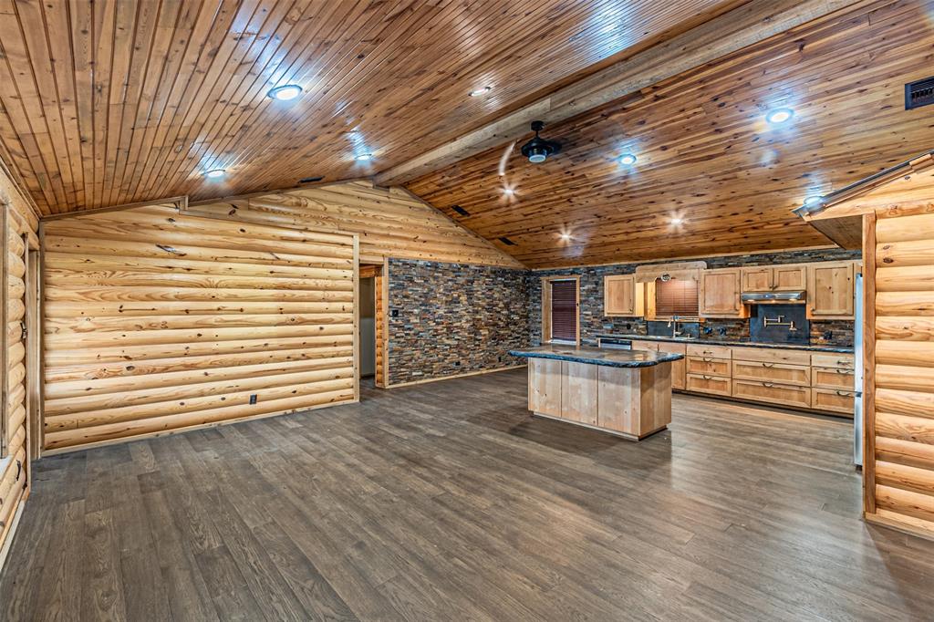 1398 Zagota Crossing Road Terrell, TX 75161 - Photo 7 of 40 a view of an empty room with wooden floor and a window