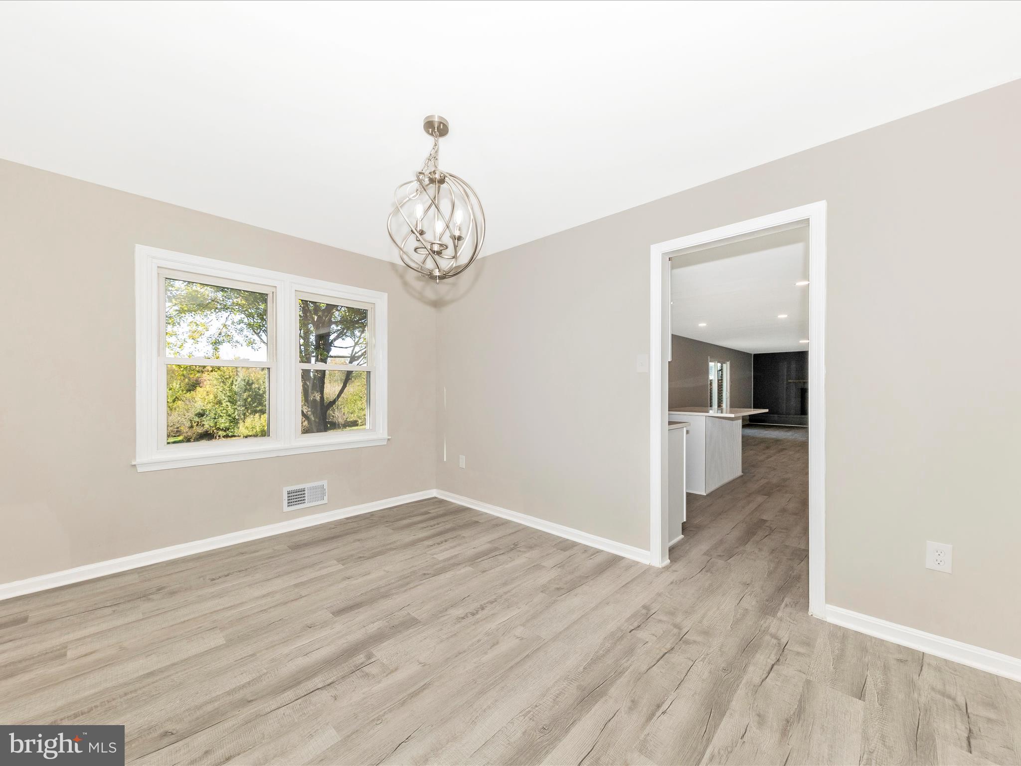 2431 Quebec School Road Middletown, MD 21769 - Photo 17 of 56 wooden floor in an empty room with a window
