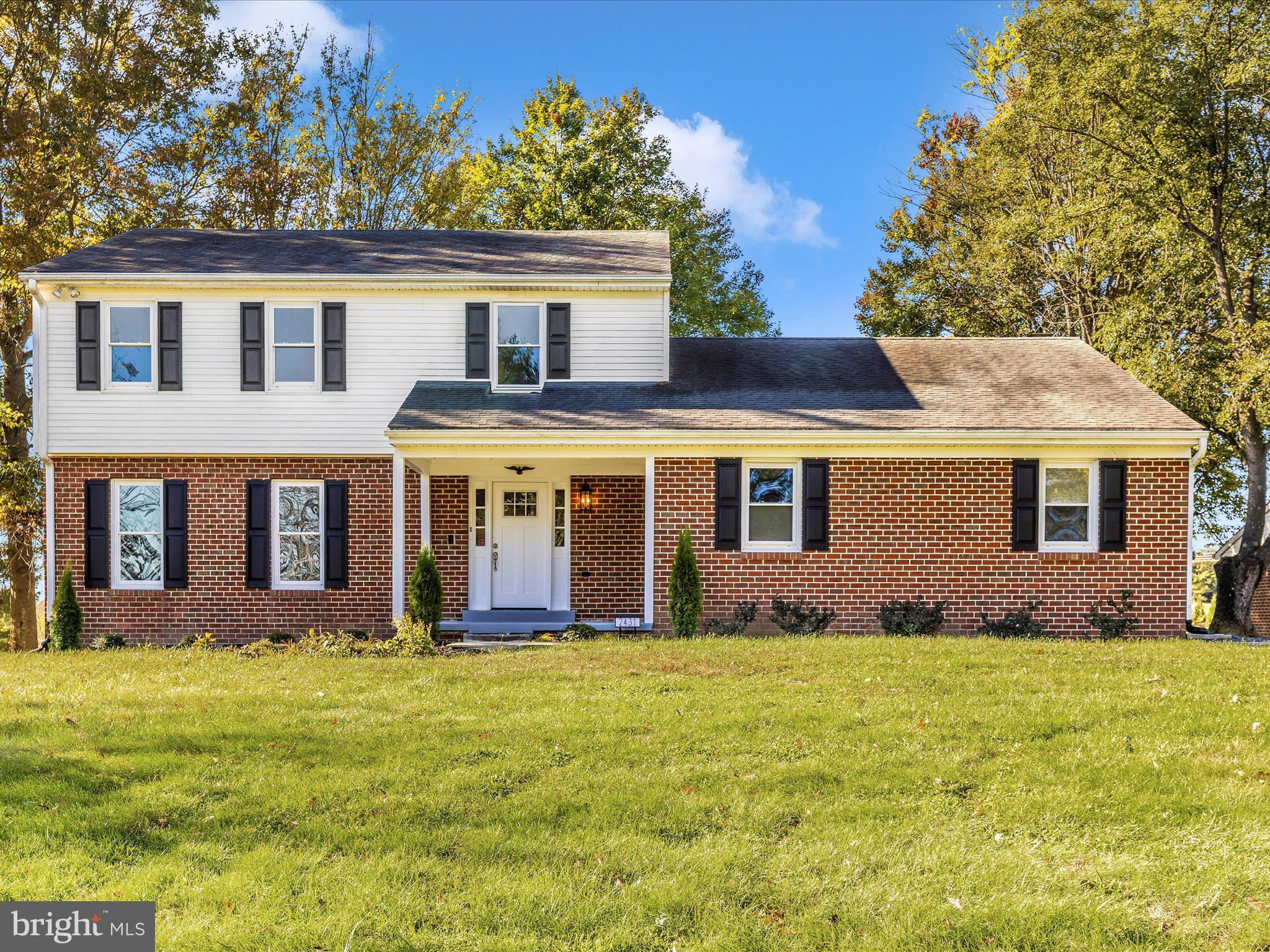 2431 Quebec School Road Middletown, MD 21769 - Photo 2 of 56 a front view of house with yard and trees in the background