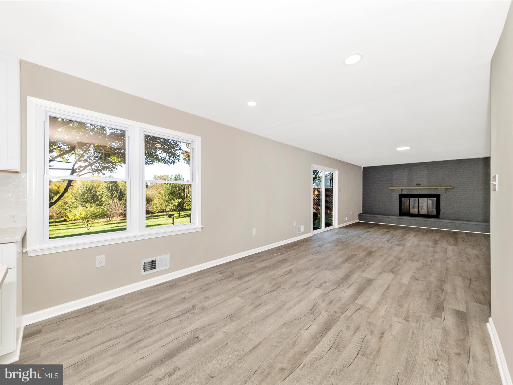 2431 Quebec School Road Middletown, MD 21769 - Photo 21 of 56 a view of empty room with wooden floor and windows