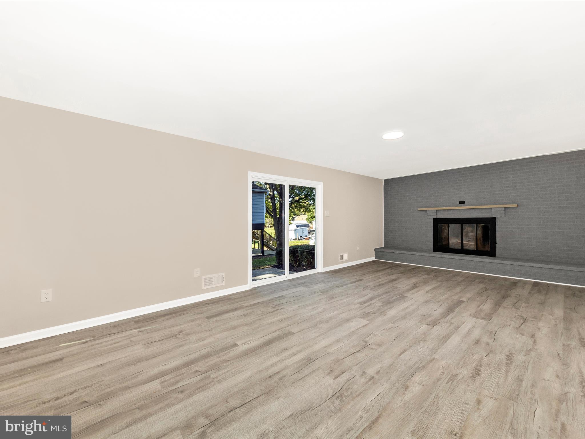 2431 Quebec School Road Middletown, MD 21769 - Photo 23 of 56 a view of empty room with wooden floor and window