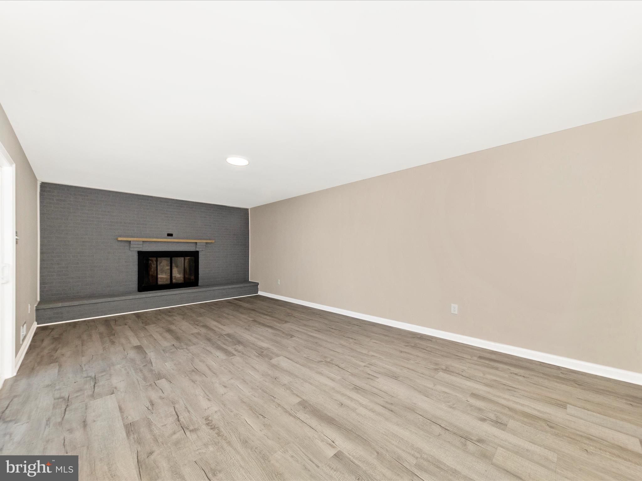 2431 Quebec School Road Middletown, MD 21769 - Photo 24 of 56 a view of an empty room with wooden floor and a window
