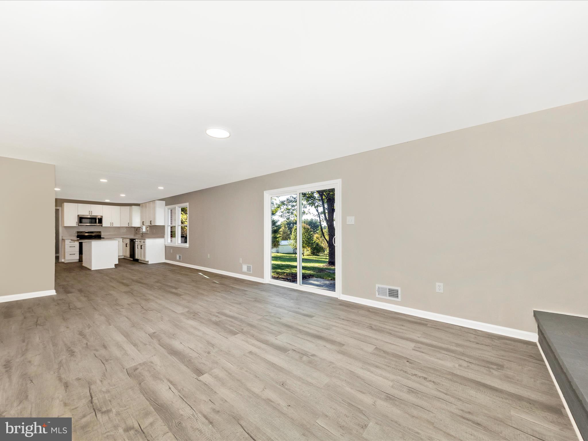 2431 Quebec School Road Middletown, MD 21769 - Photo 25 of 56 a view of empty room with wooden floor and window