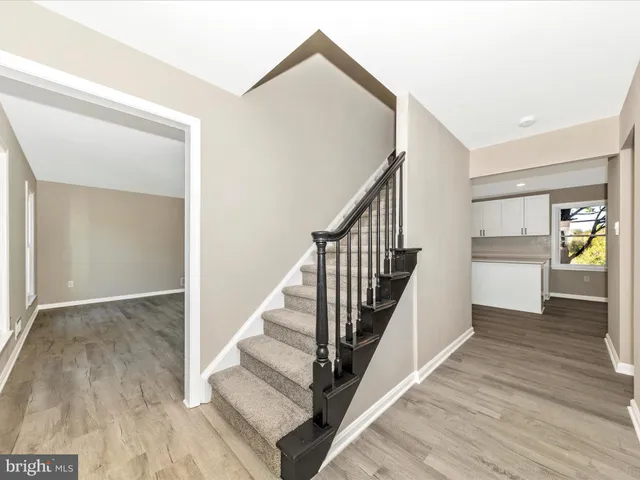 a view of a livingroom with a ceiling fan and window