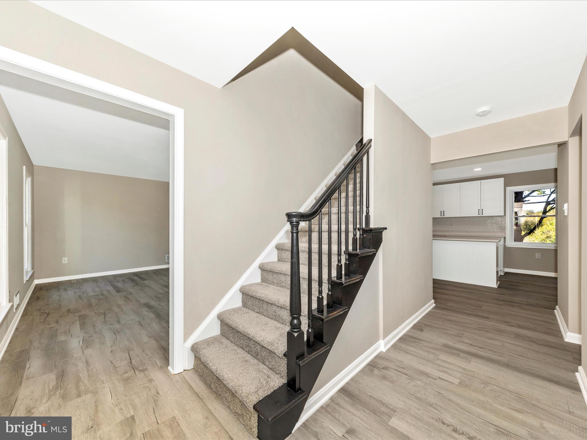 2431 Quebec School Road Middletown, MD 21769 - Photo 28 of 56 a view of a hallway with wooden floor and entryway