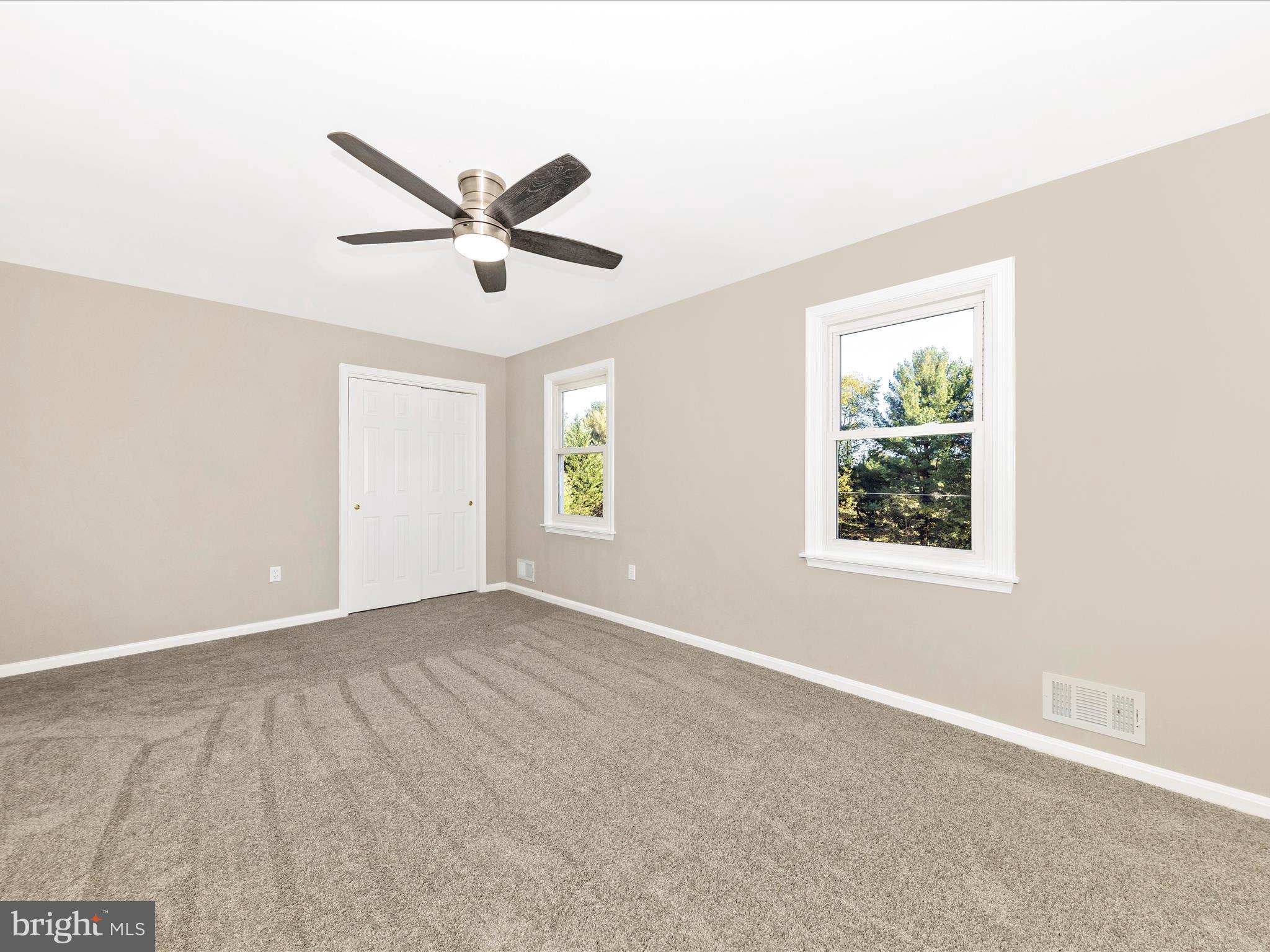 2431 Quebec School Road Middletown, MD 21769 - Photo 30 of 56 a view of a livingroom with a ceiling fan and window