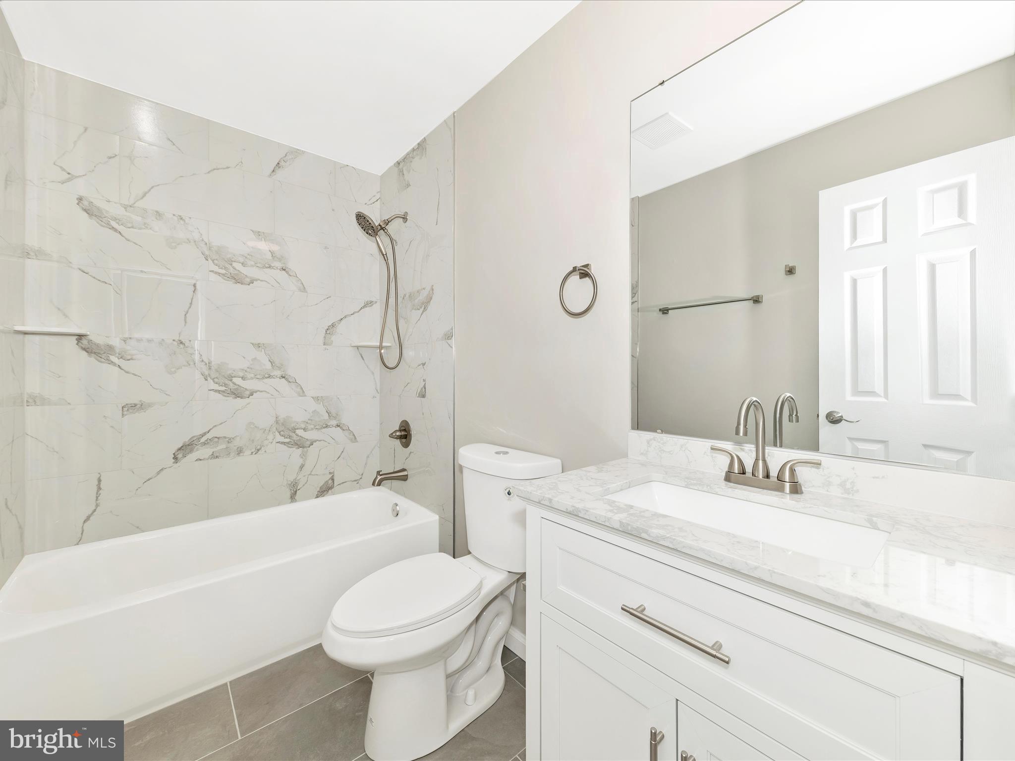 2431 Quebec School Road Middletown, MD 21769 - Photo 38 of 56 a bathroom with a sink a toilet and a bathtub