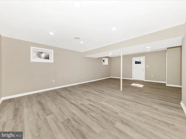 an empty room with wooden floor