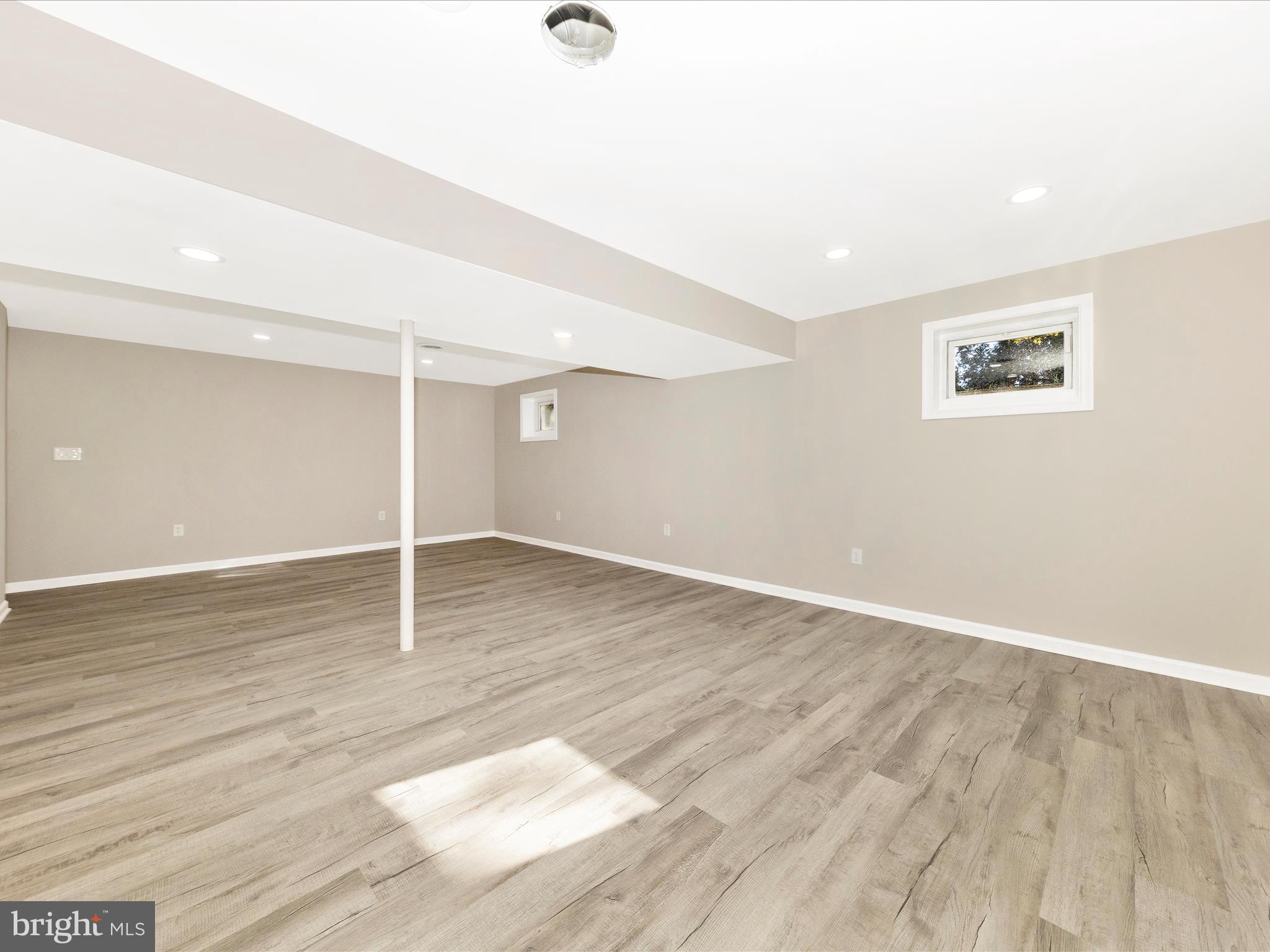 2431 Quebec School Road Middletown, MD 21769 - Photo 42 of 56 an empty room with wooden floor