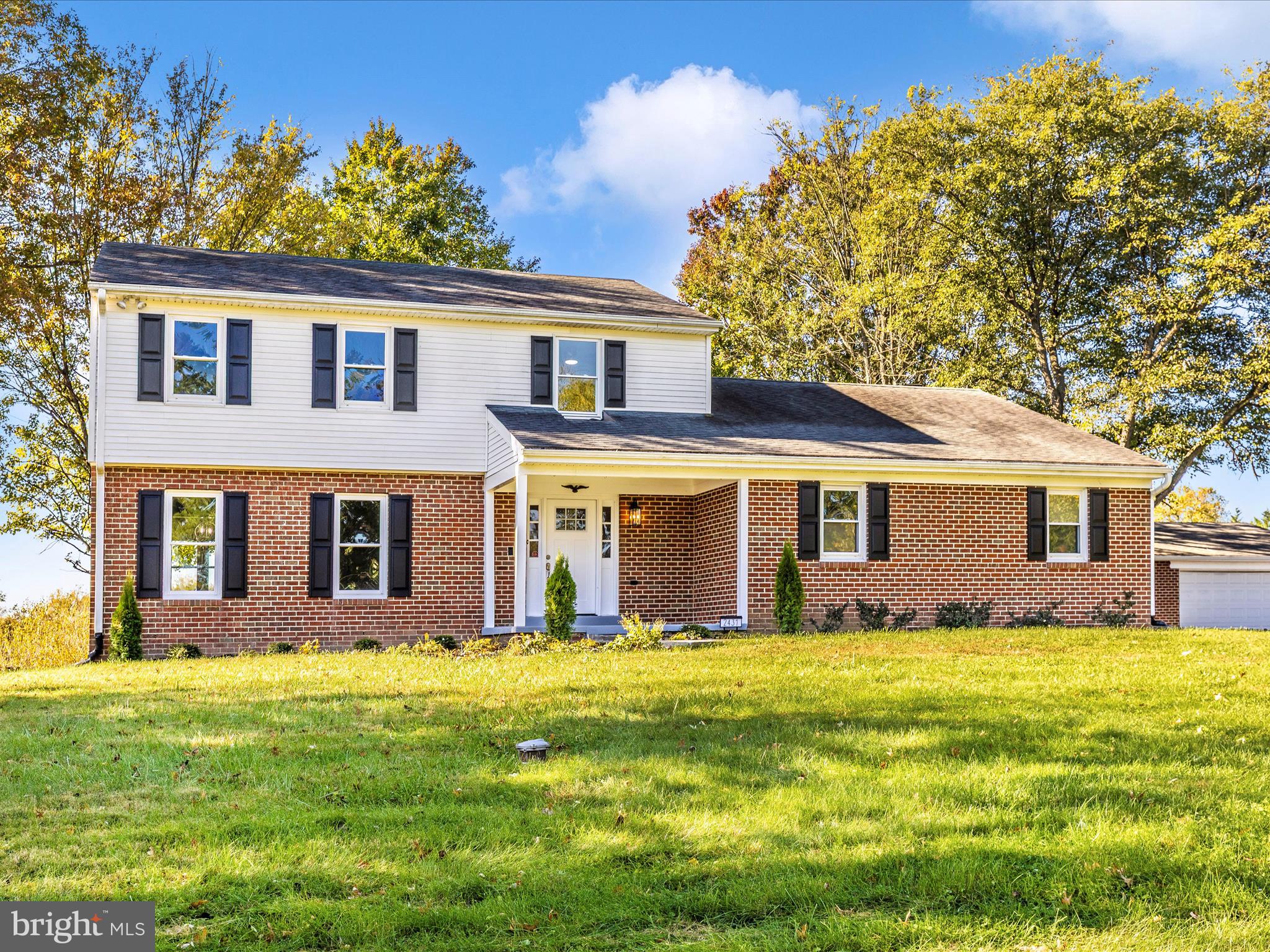 2431 Quebec School Road Middletown, MD 21769 - Photo 45 of 56 a front view of house with yard and trees in the background
