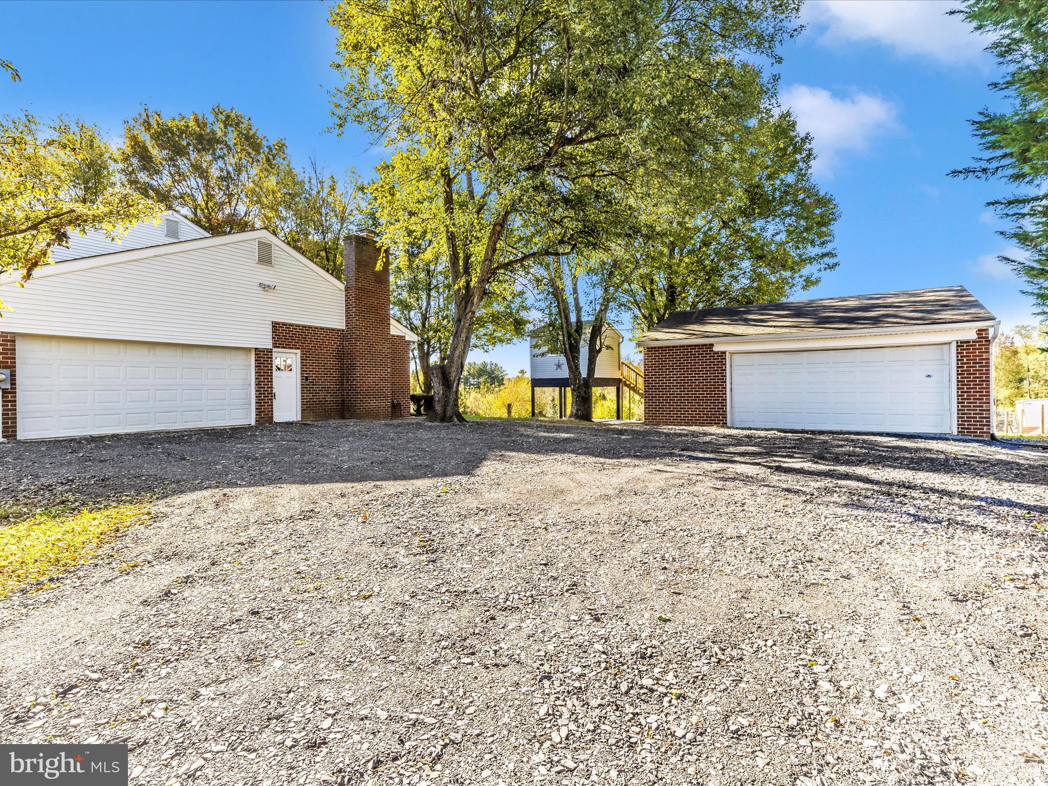 2431 Quebec School Road Middletown, MD 21769 - Photo 48 of 56 a view of a house with a yard and large tree