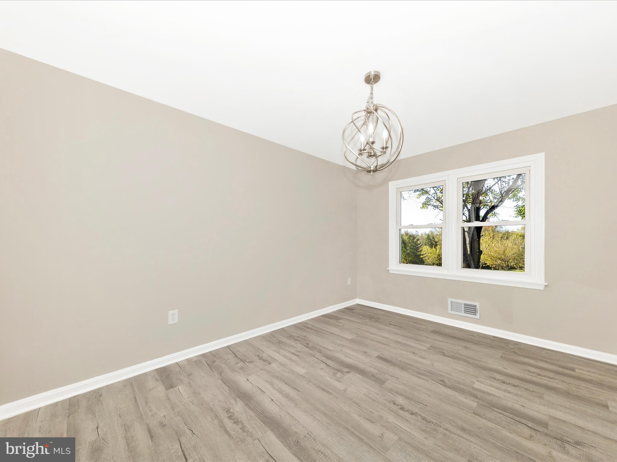 2431 Quebec School Road Middletown, MD 21769 - Photo 9 of 56 a view of room with wooden floor and window