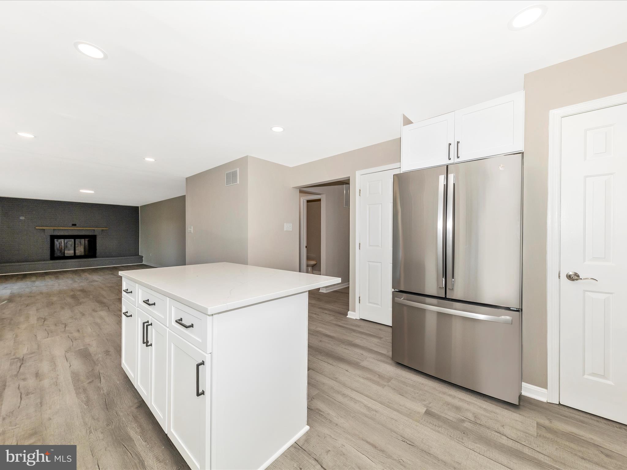 2431 Quebec School Road Middletown, MD 21769 - Photo 10 of 56 a kitchen with stainless steel appliances a refrigerator and a stove top oven