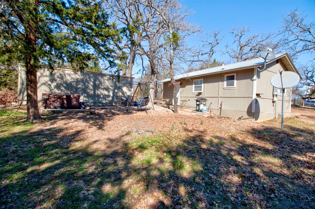 374 Hideaway Lane Valley View, TX 76272 - Photo 7 of 35 Perfect area to relax, and enjoy a BBQ, with family and friends!