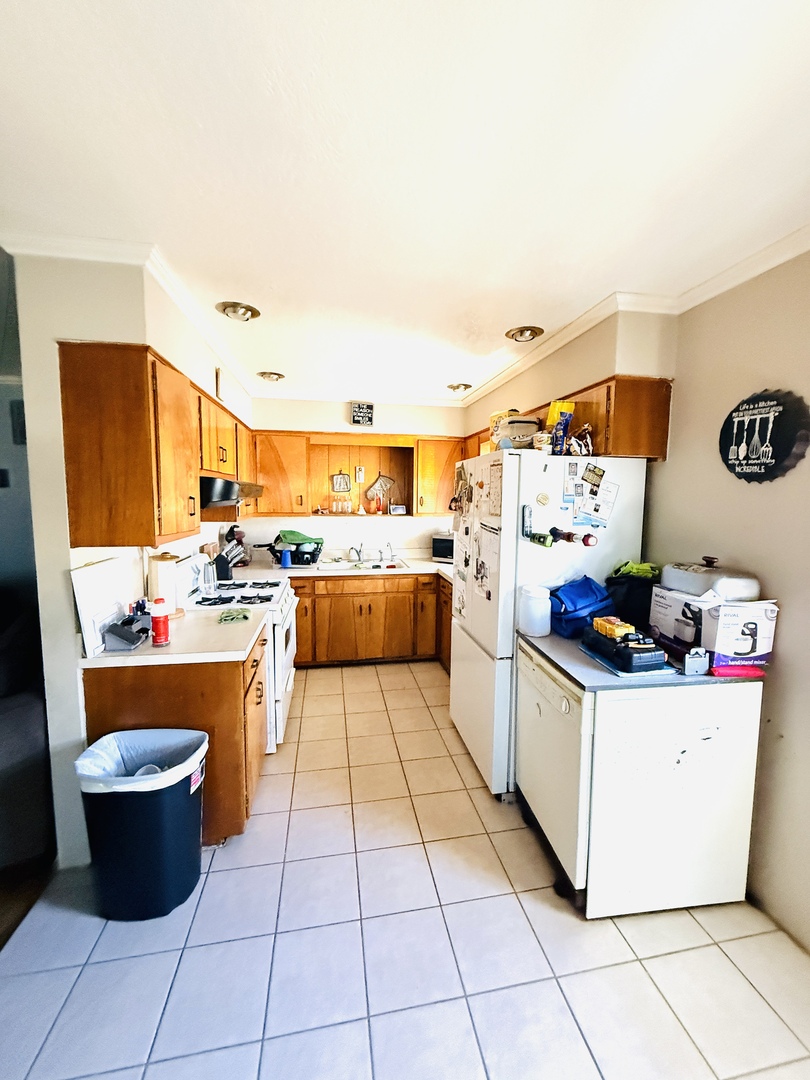 570 1st N Street Wellington, IL 60973 - Photo 4 of 14 a kitchen with stainless steel appliances kitchen island granite countertop a stove and a sink