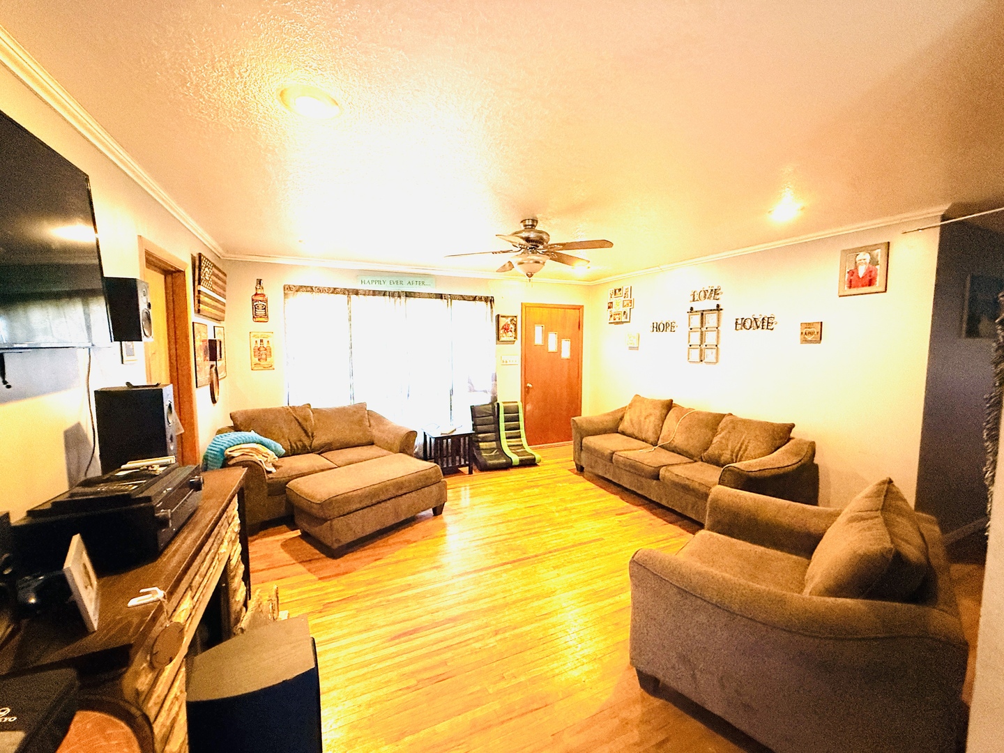 570 1st N Street Wellington, IL 60973 - Photo 6 of 14 a living room with furniture and a flat screen tv