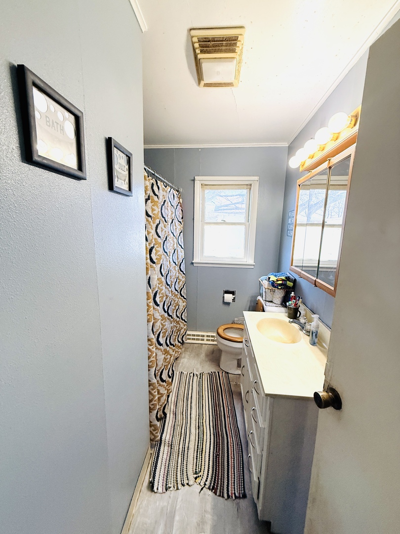 570 1st N Street Wellington, IL 60973 - Photo 7 of 14 a bedroom with a bed and a table