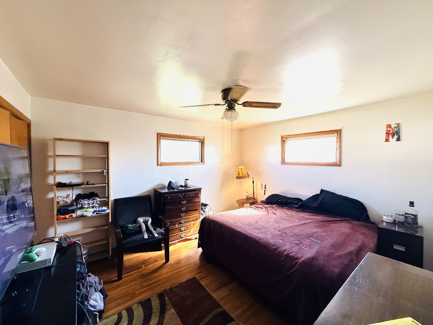 570 1st N Street Wellington, IL 60973 - Photo 9 of 14 a bedroom with a bed and wooden floor