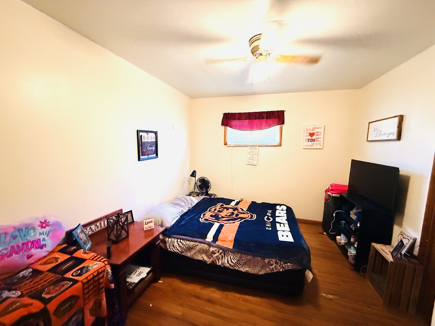 570 1st N Street Wellington, IL 60973 - Photo 10 of 14 a bedroom with a bed and a flat screen tv