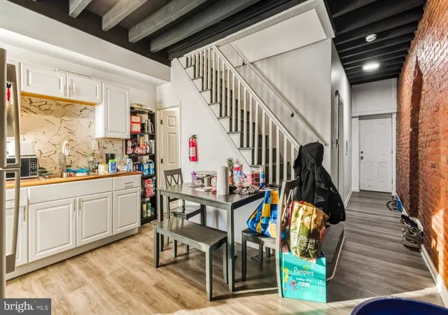 a very nice looking room with wooden floor and windows