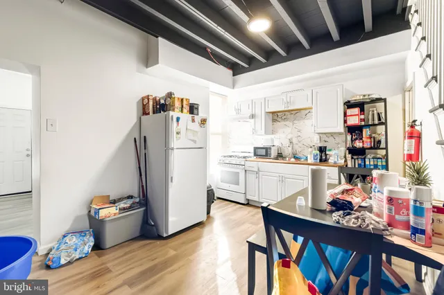 a view of workspace with wooden floor windows
