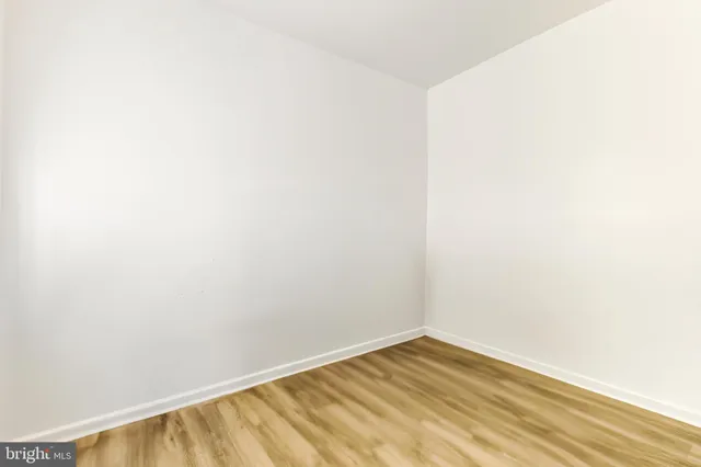 a bedroom with a bed closet and window