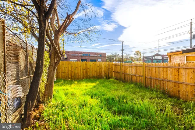a view of a backyard of the house