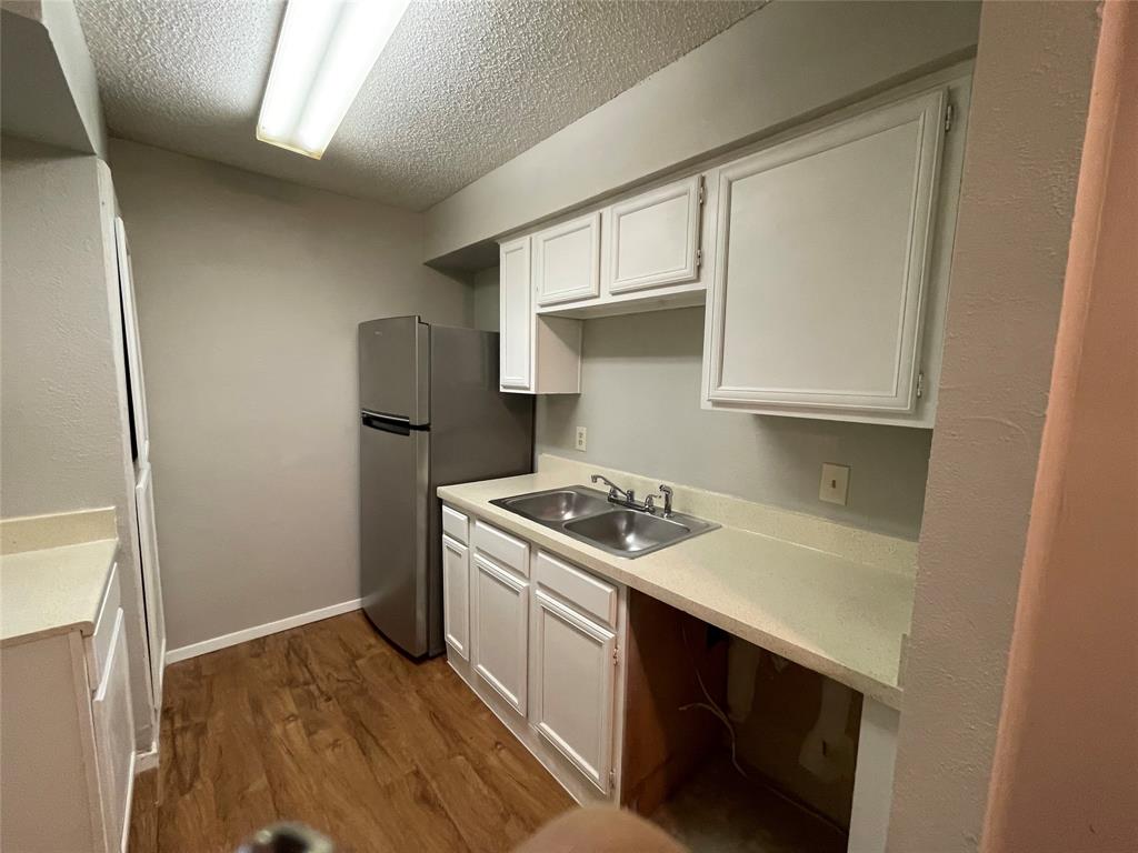 9696 Walnut Street, Unit 1413 Dallas, TX 75243 - Photo 13 of 17 a kitchen with a stove and a sink
