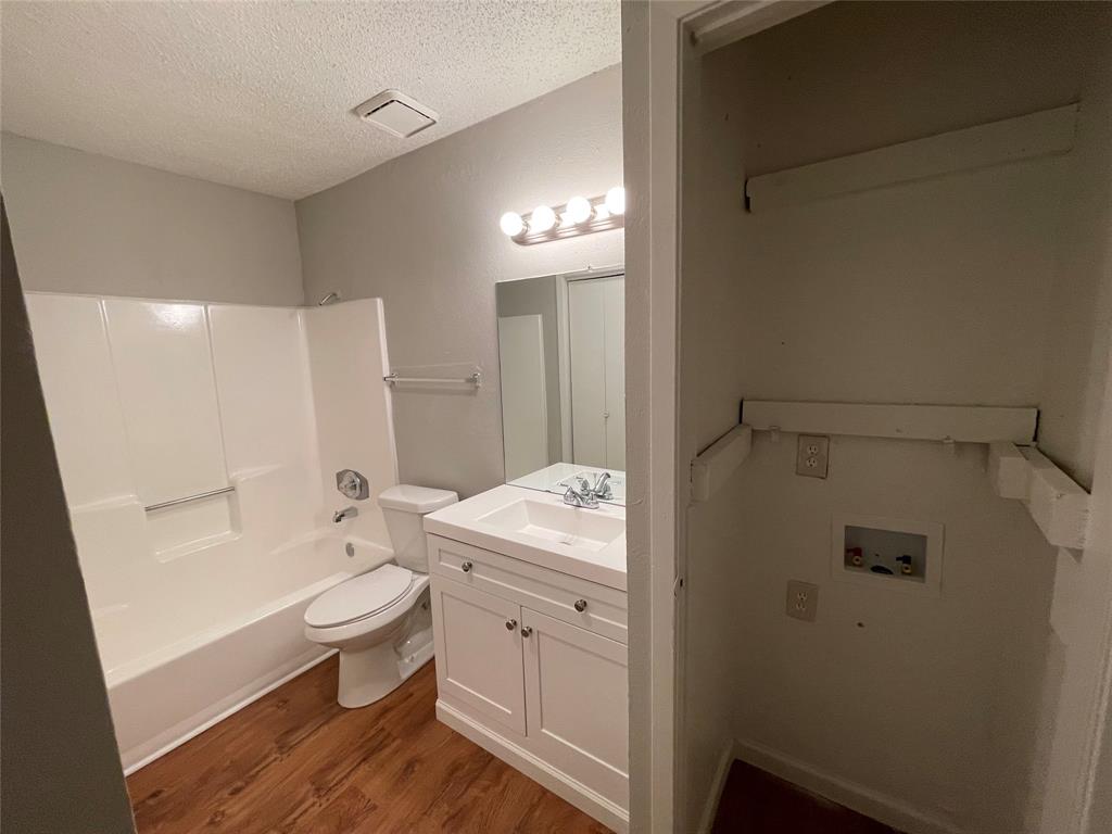 9696 Walnut Street, Unit 1413 Dallas, TX 75243 - Photo 15 of 17 a bathroom with a sink a toilet and shower